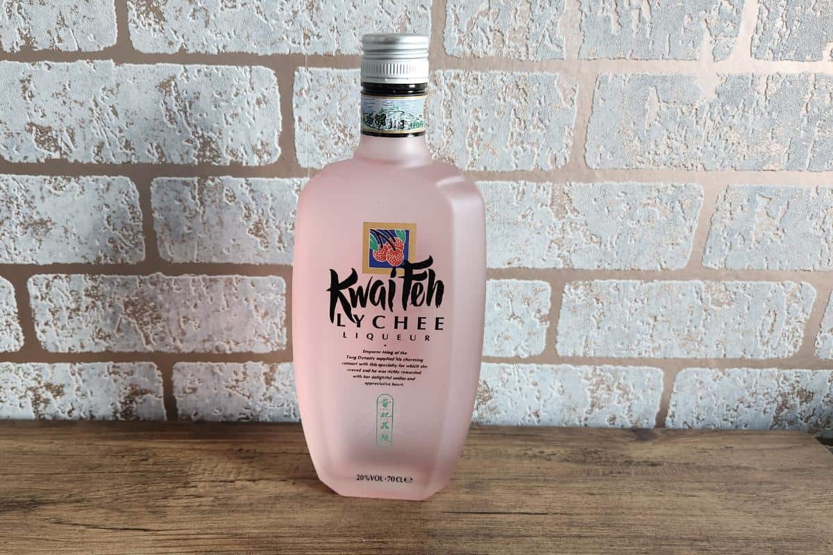 bottle of lychee liqueur that looks light pink in colour