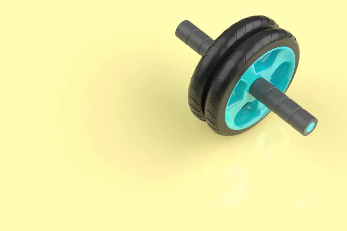 An abs wheel on a yellow surface.