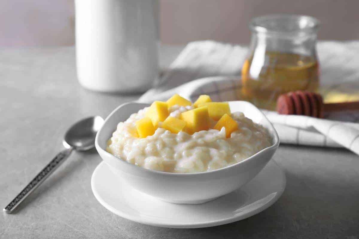 Rice pudding made with cream soda and topped with chunks of mango.