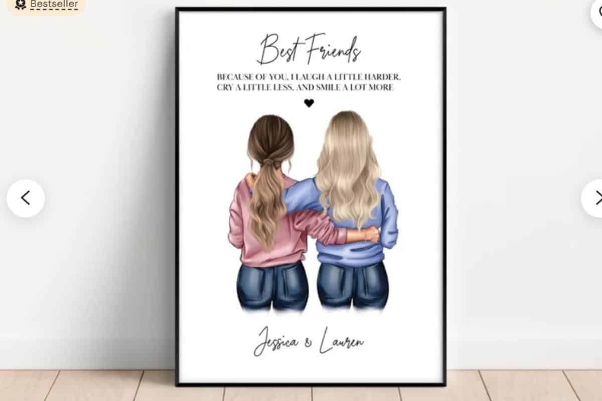A framed best friend poster with two girls cuddling and the phrase - because of you I laugh a little harder, cry a little less and smile a lot more.