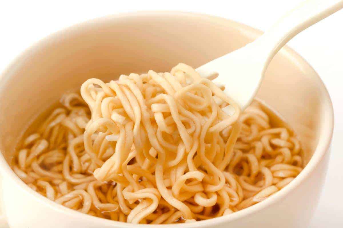 cooked noodles on a white fork.