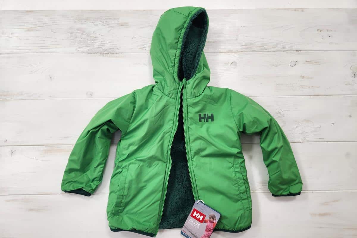 Childrens Helly Hansen green fleece and rainproof reversible coat.