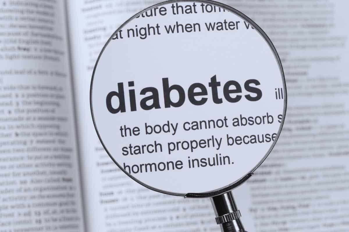 A magnifying glass highlights the word "diabetes" in a medical text, emphasizing how diet choices can significantly affect its onset and management.