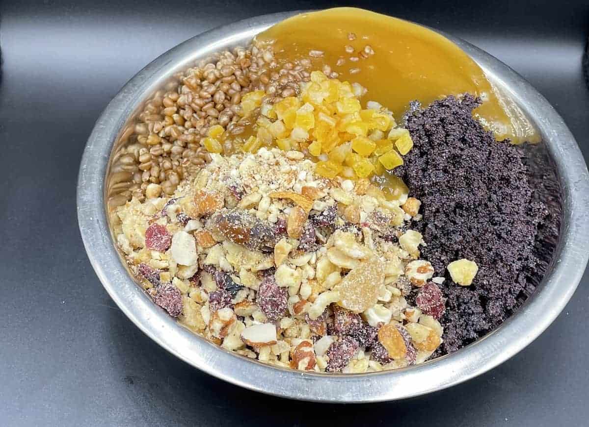 Chopped dried fruit and nuts in a steel plate.