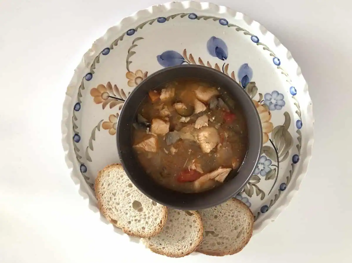 Beef strongaoff with bread in a plate.