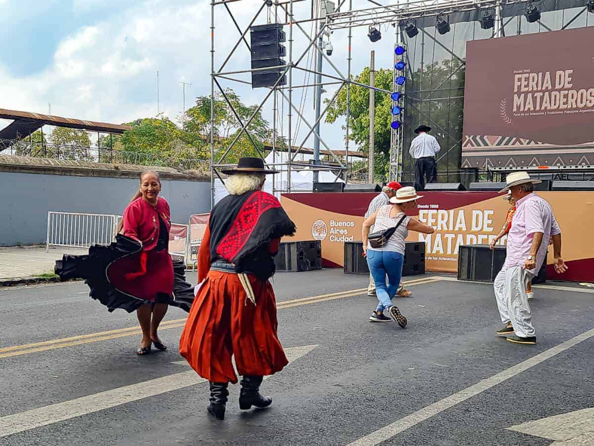 Traditional dancers performing at Feria de Mataderos, a vibrant and off-the-beaten-path cultural fair in Buenos Aires. This unique event celebrates Argentine heritage with live folk music, traditional dances, artisanal crafts, and regional cuisine, offering visitors an authentic glimpse into the country’s rural traditions and gaucho culture.