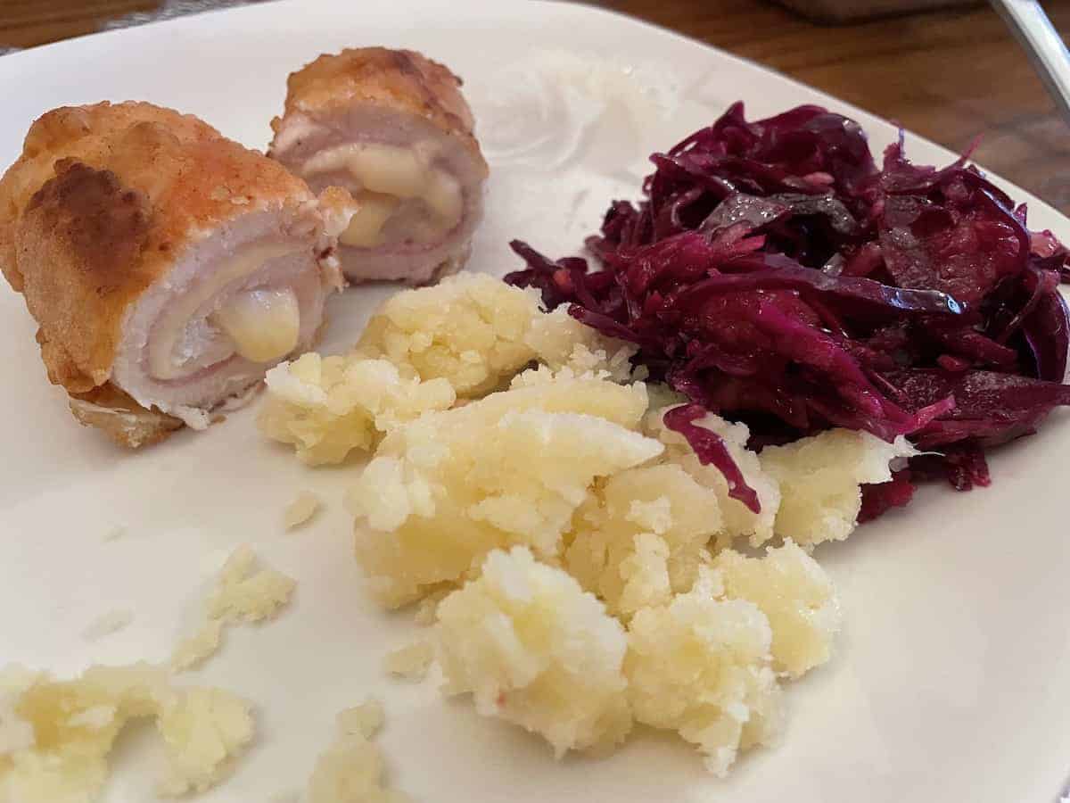 Polish chicken Kiev with mashed potatoes and beetroot salad.