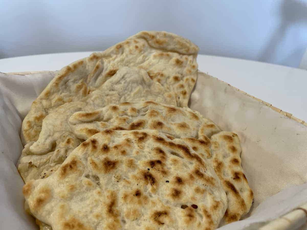 Polish podpłomyki flatbreads in a bread basket.