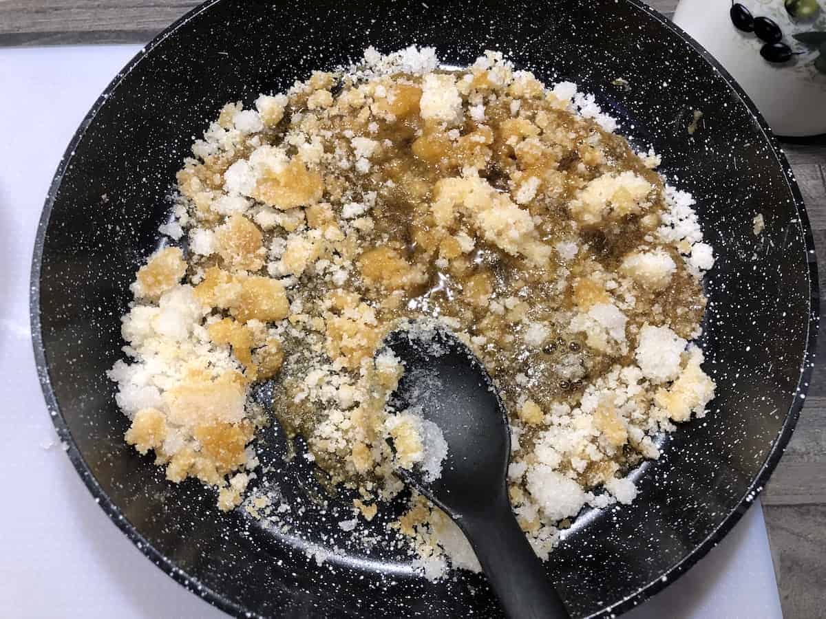 Caramelizing sugar in a pan.