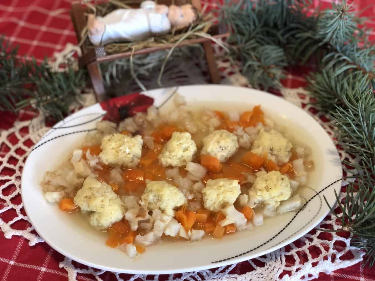 Ryba w galarecie in a white dish.