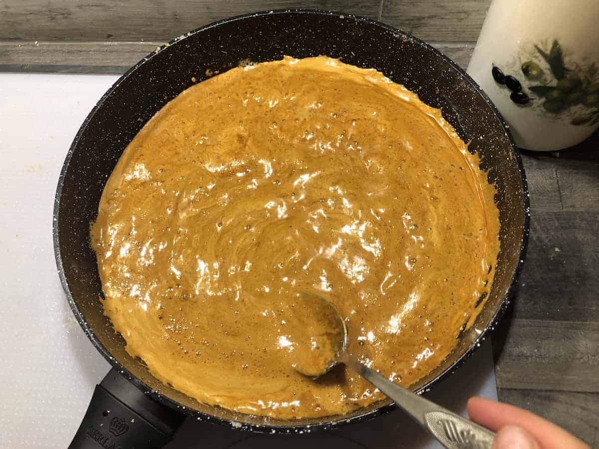 Caramelized sugar being stirred.