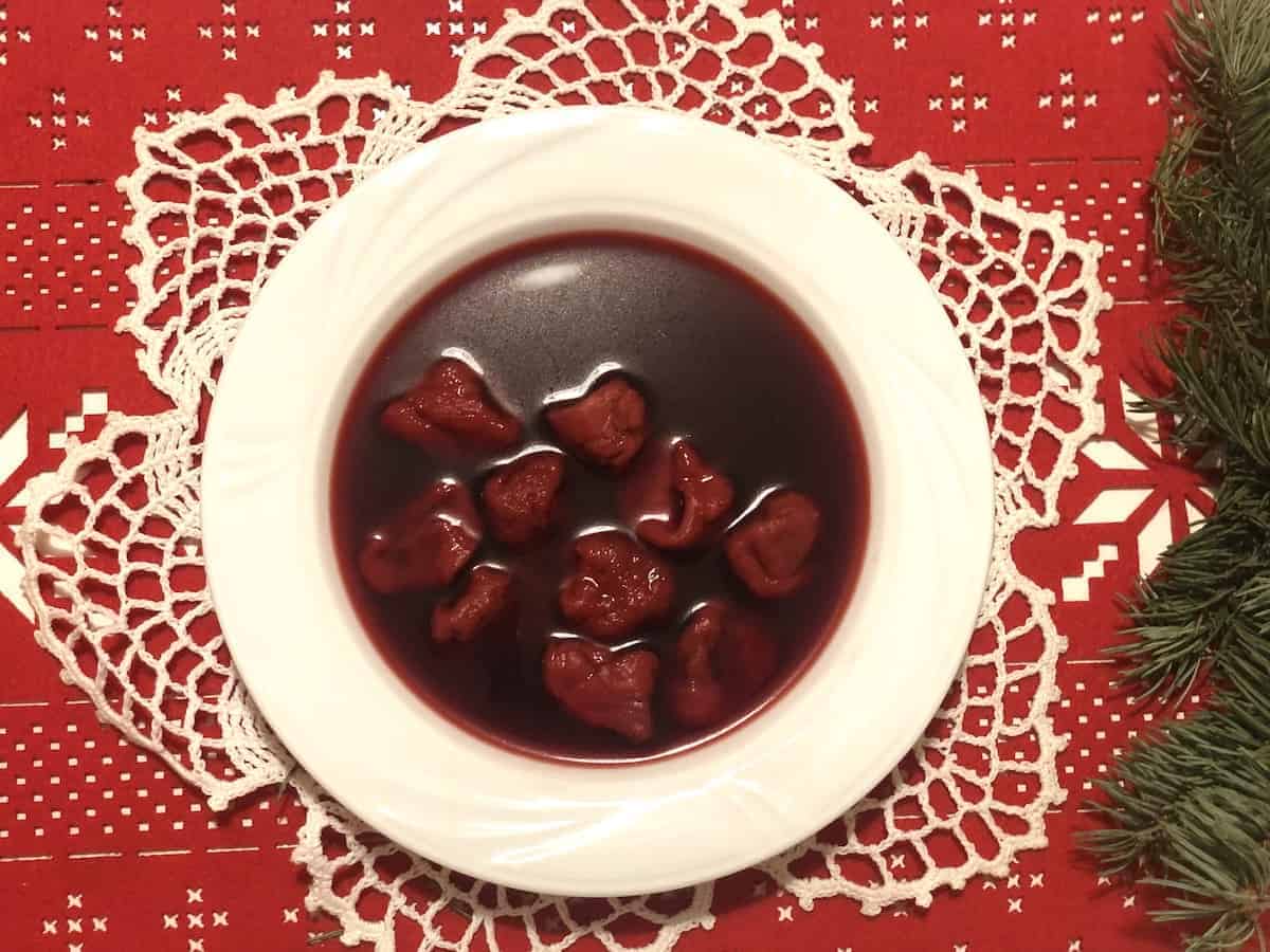 Polish Christmas beetroot soup in a white bowl.