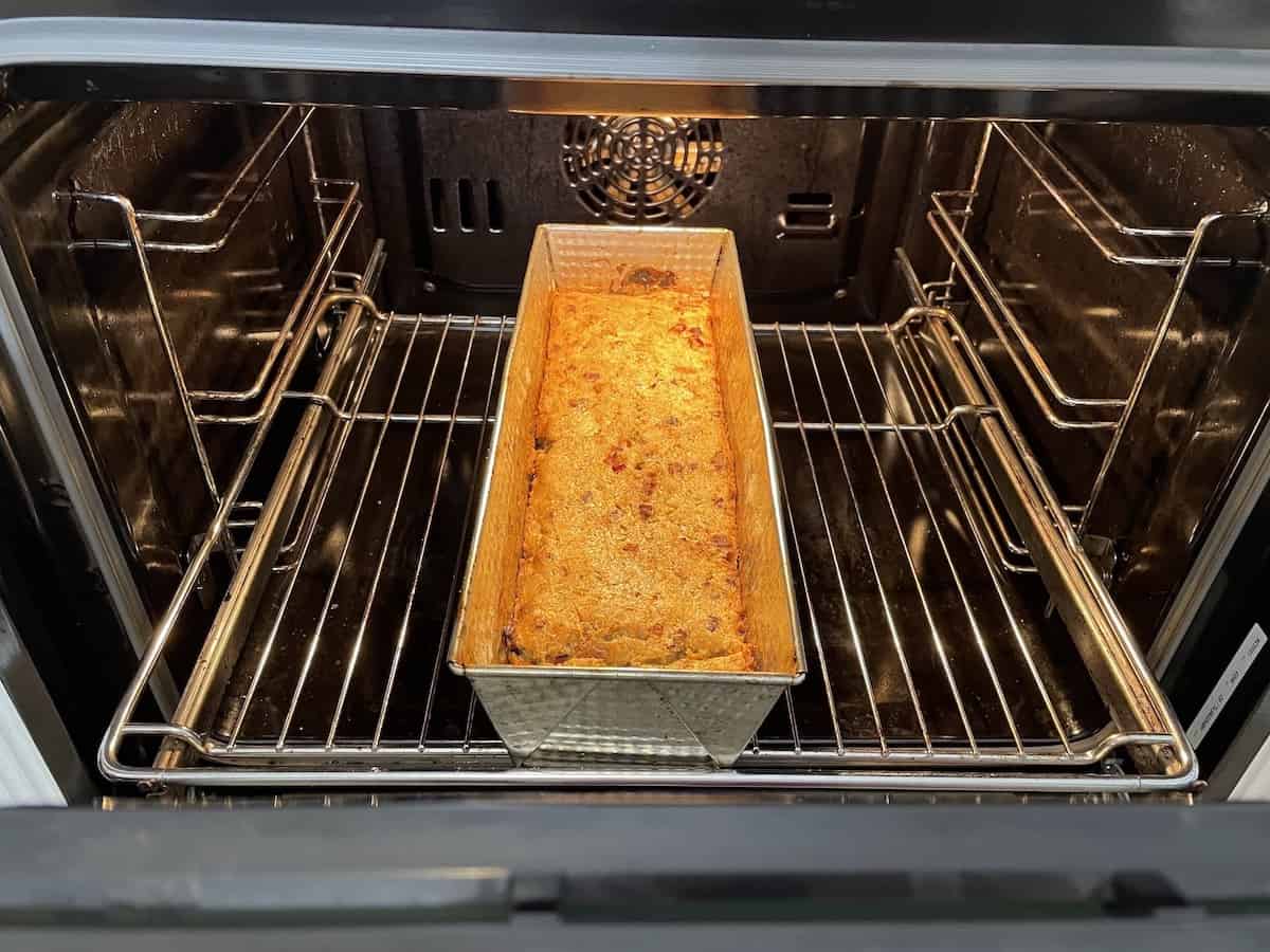 Polish babka ziemniaczana baking in an oven.