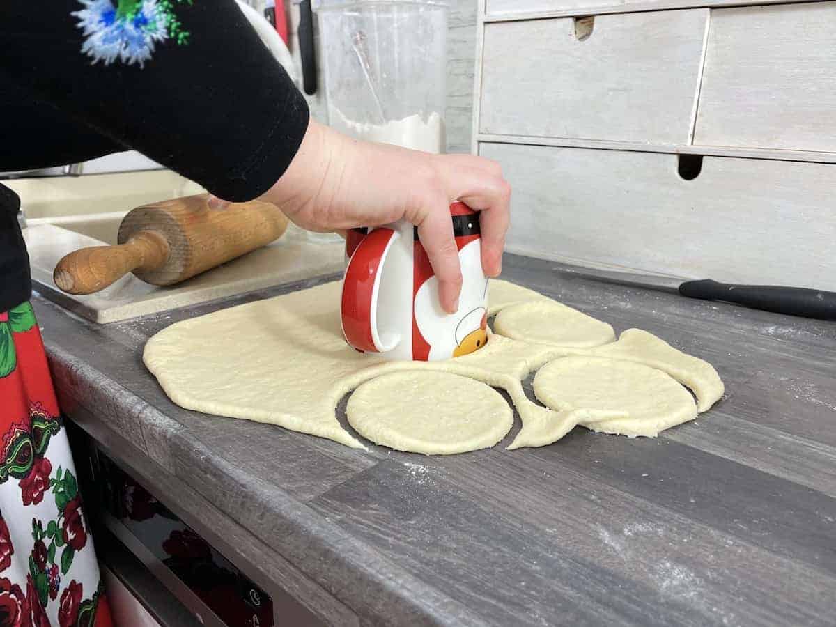 Use a cup to cut out the donuts.