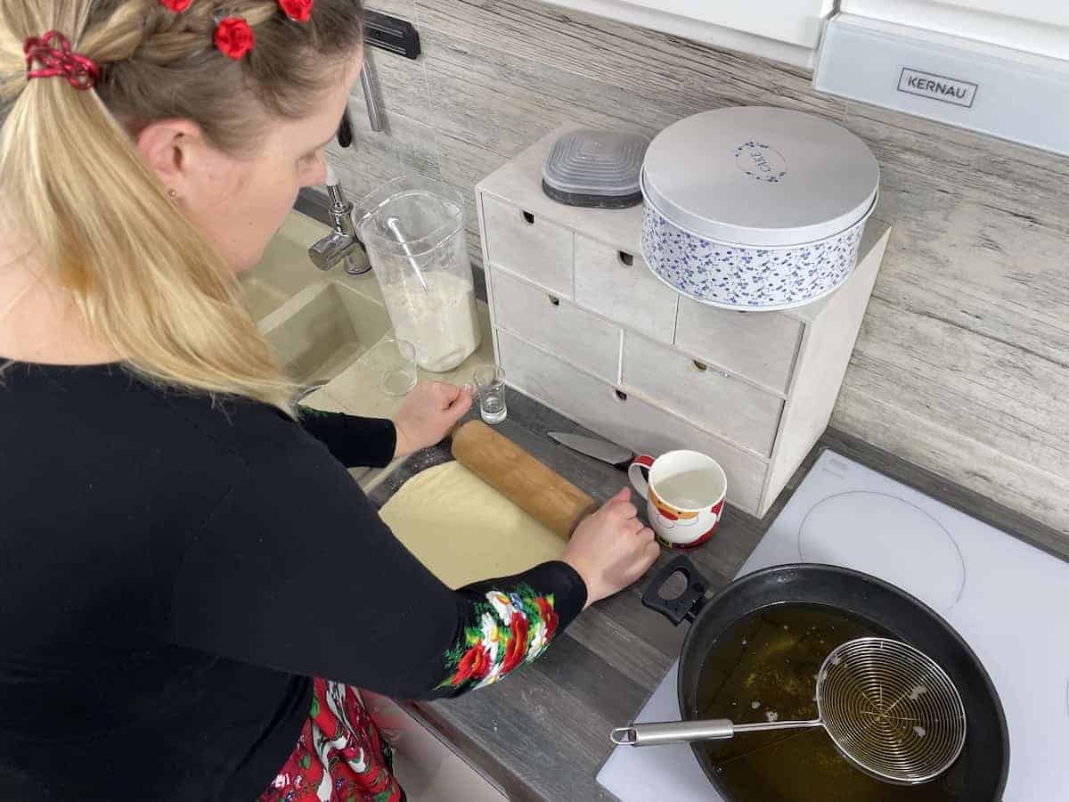 Rolling the oponki dough.