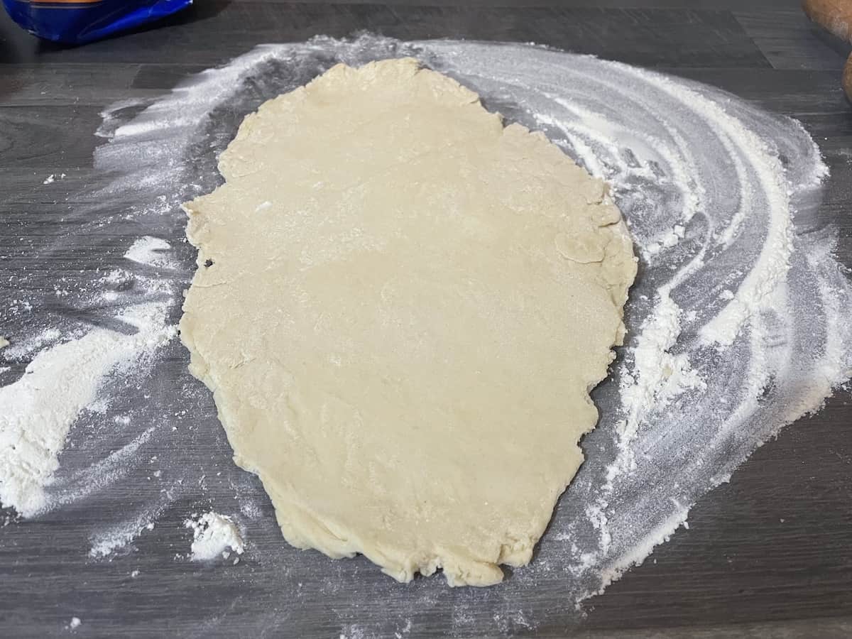 Roll out the dough on a floured surface.