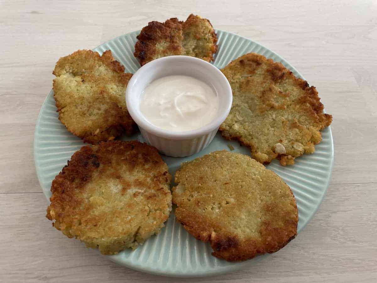 Serve placki ziemniaczane with sour cream.