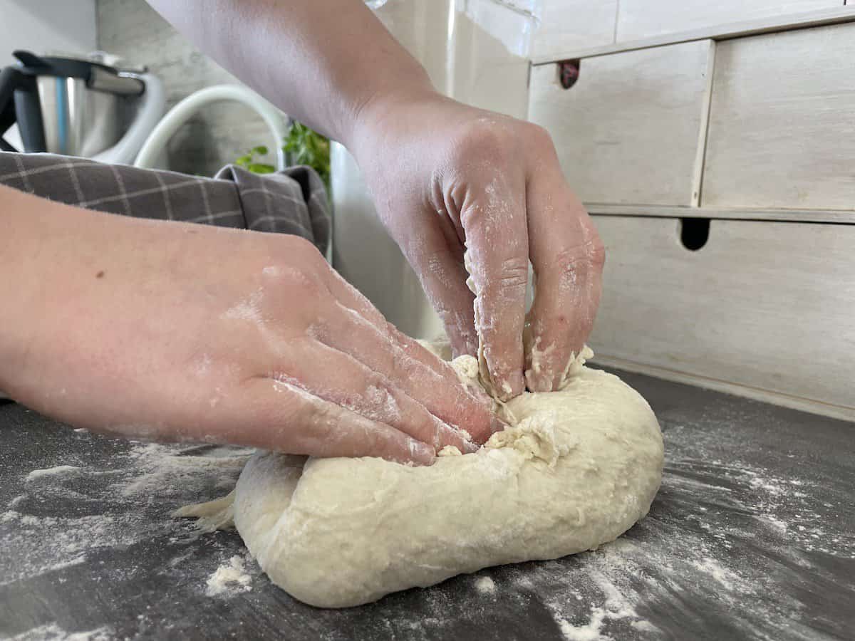 Knead the dough on a floured flat surface.