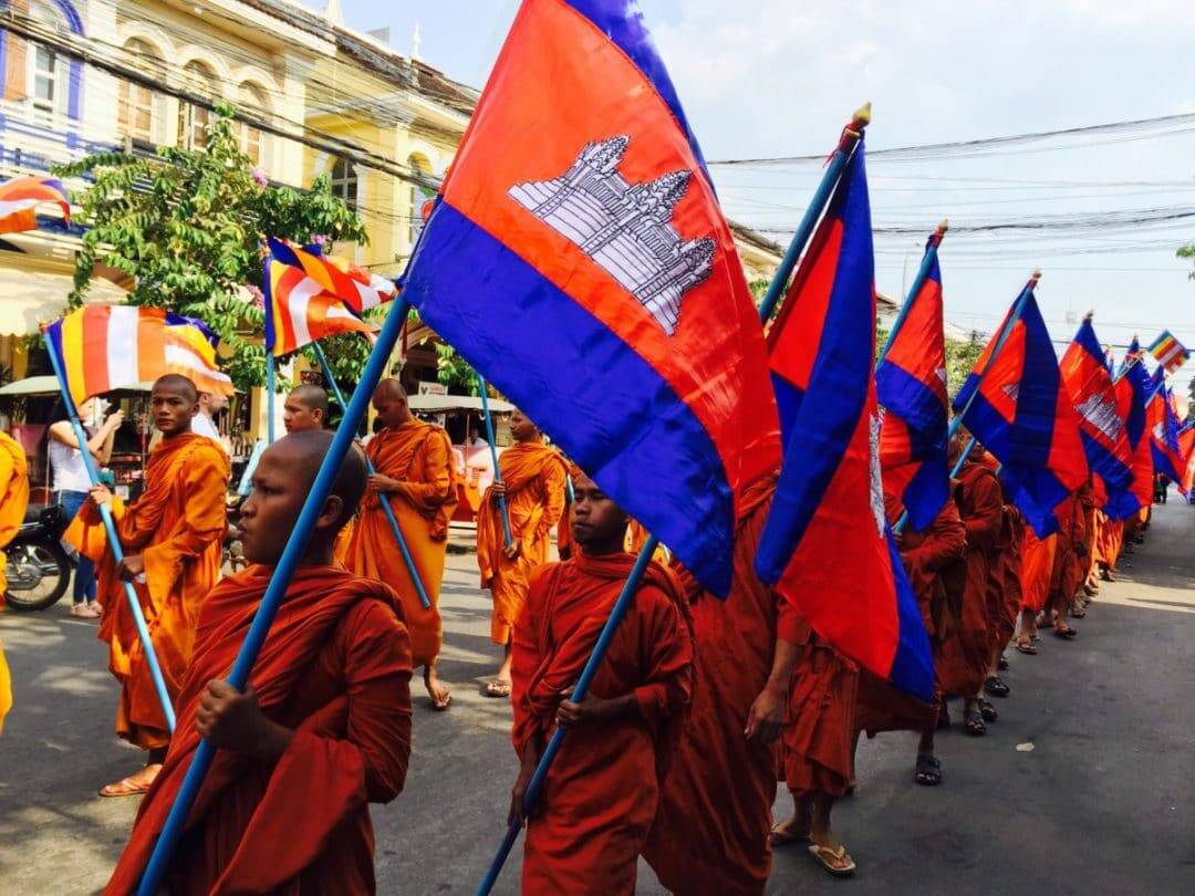 Monks walking in the parade for Meak Bochea Festival - Living and Working in Siem Reap - Four Month Update