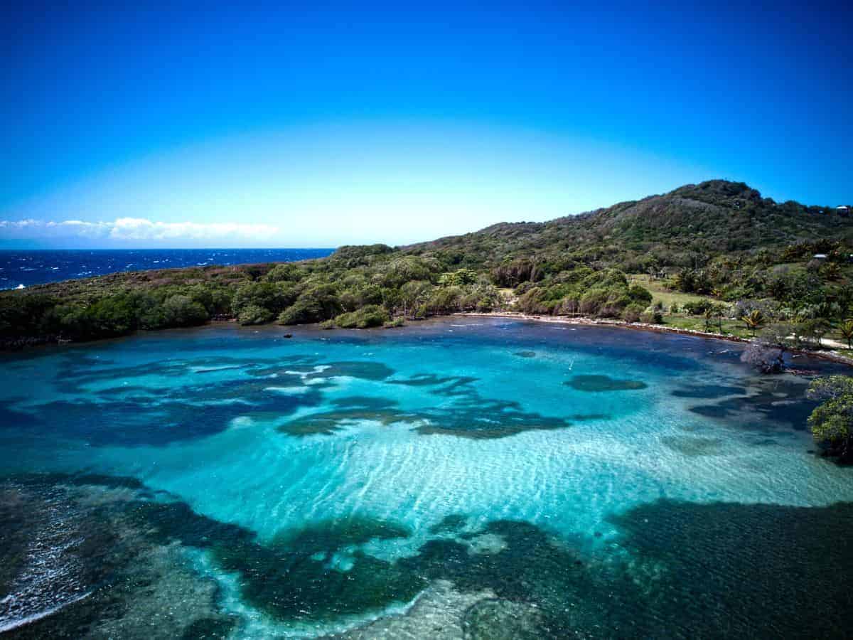 Best Things to Do on Roatan in Honduras. Best Things to Do on Roatan in Honduras. Aerial view of deserted beach in Honduras