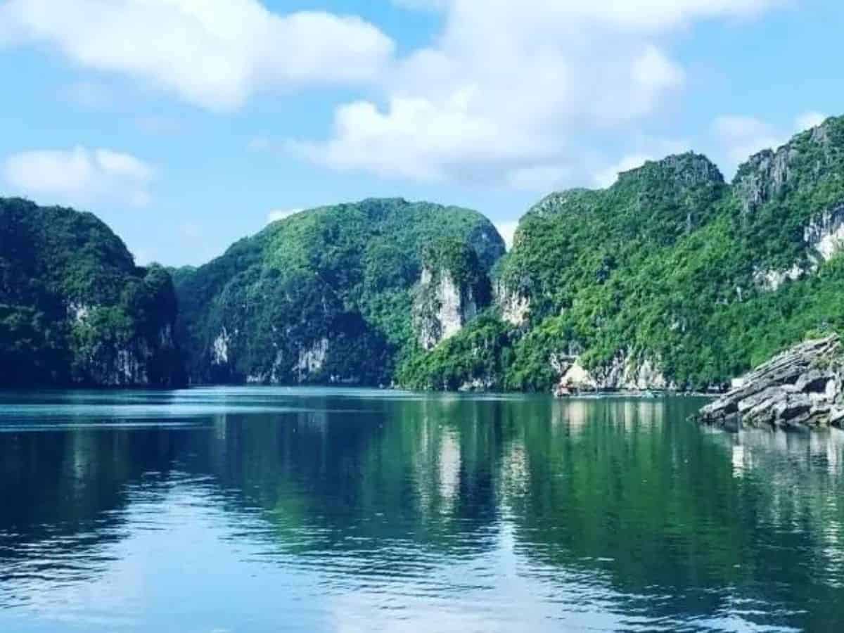Untouristy Halong Bay Tour from Cat Ba Island in Vietnam Untouristy Halong Bay Tour from Cat Ba Island, image of limestone casts emerging from the sea.