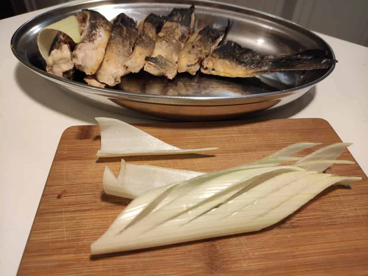 Slices of carp in a steel dish.