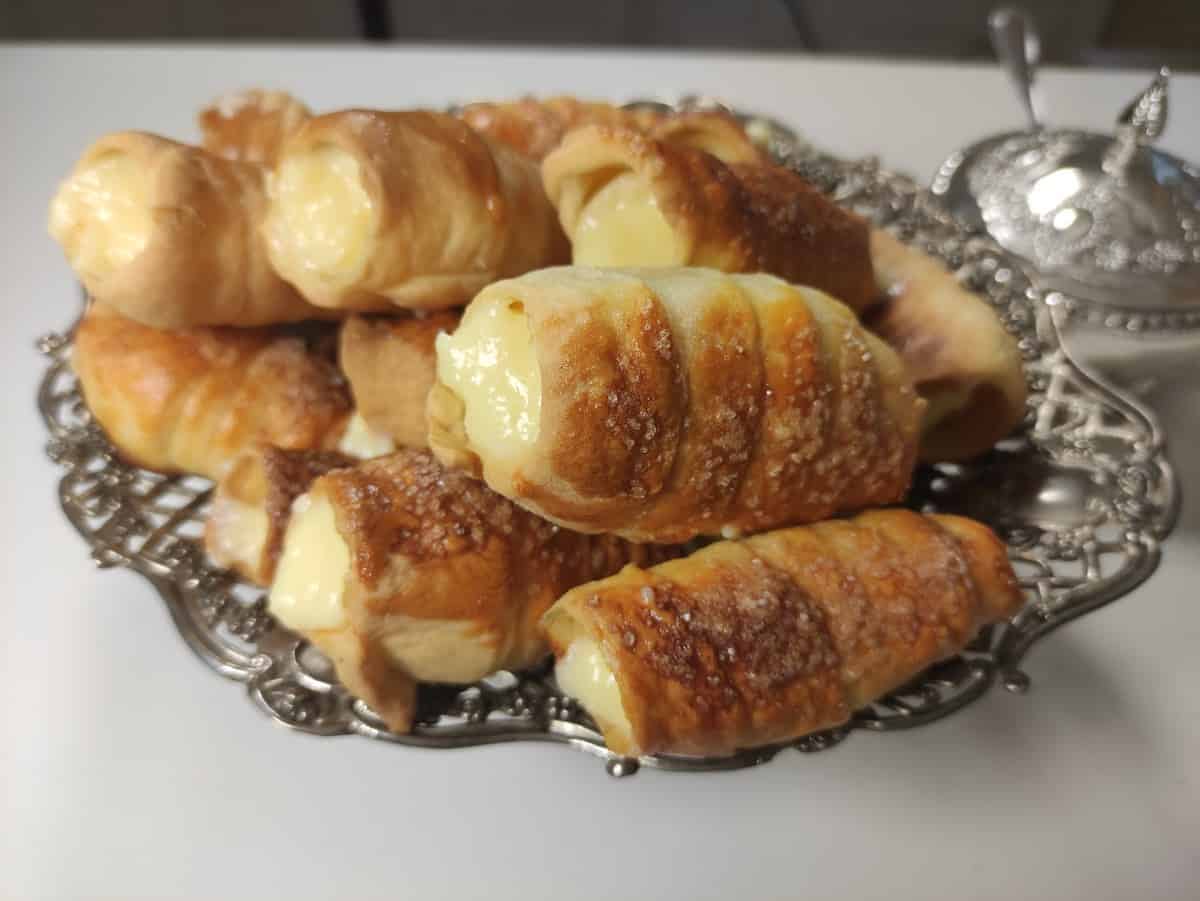 Cream horns will with custard.