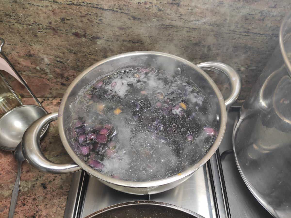 Boil the vegetables for Polish re cabbage soup.