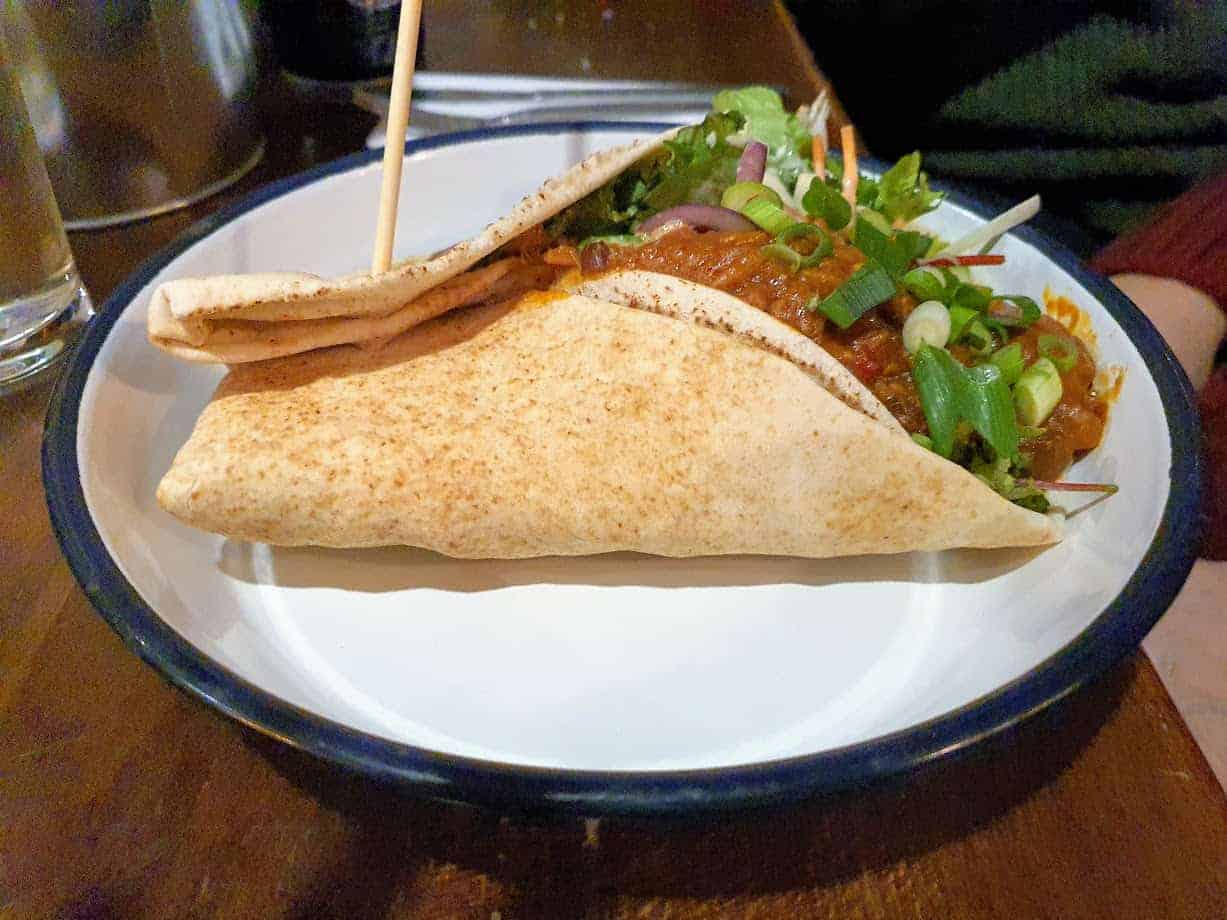 A BBQ pulled jackfruit kebab on white plate