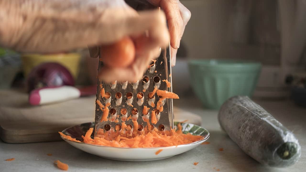 Carrots being grated.