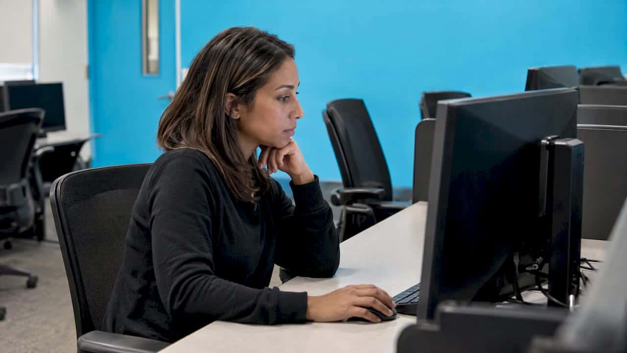 Candidate taking a computer-based aviation theory exam