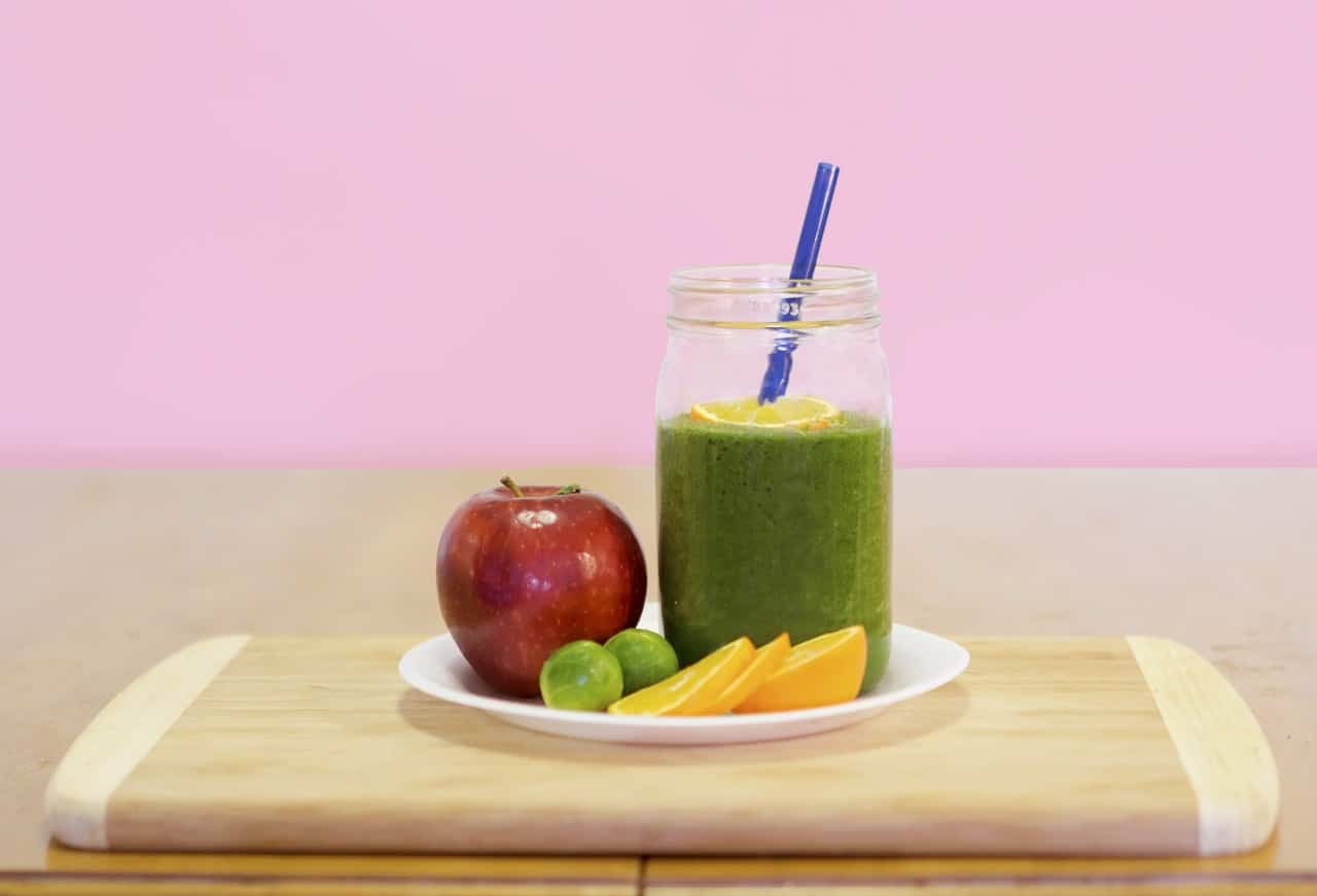 smoothie on plate of fruits