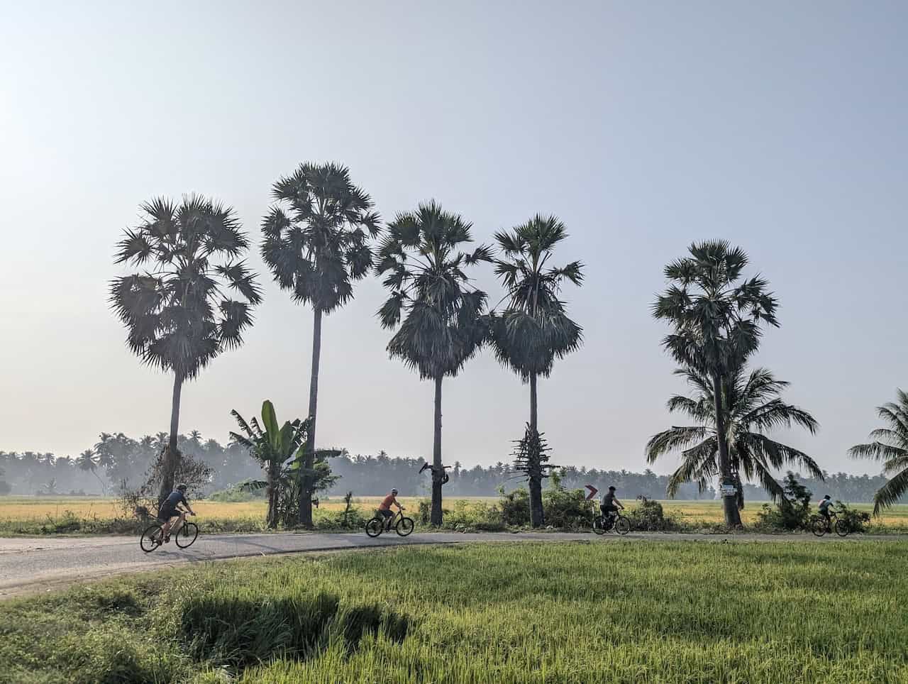 Sri Lanka backroad cycling tour riders cycling through scenic countryside roads surrounded by tropical landscapes and local villages