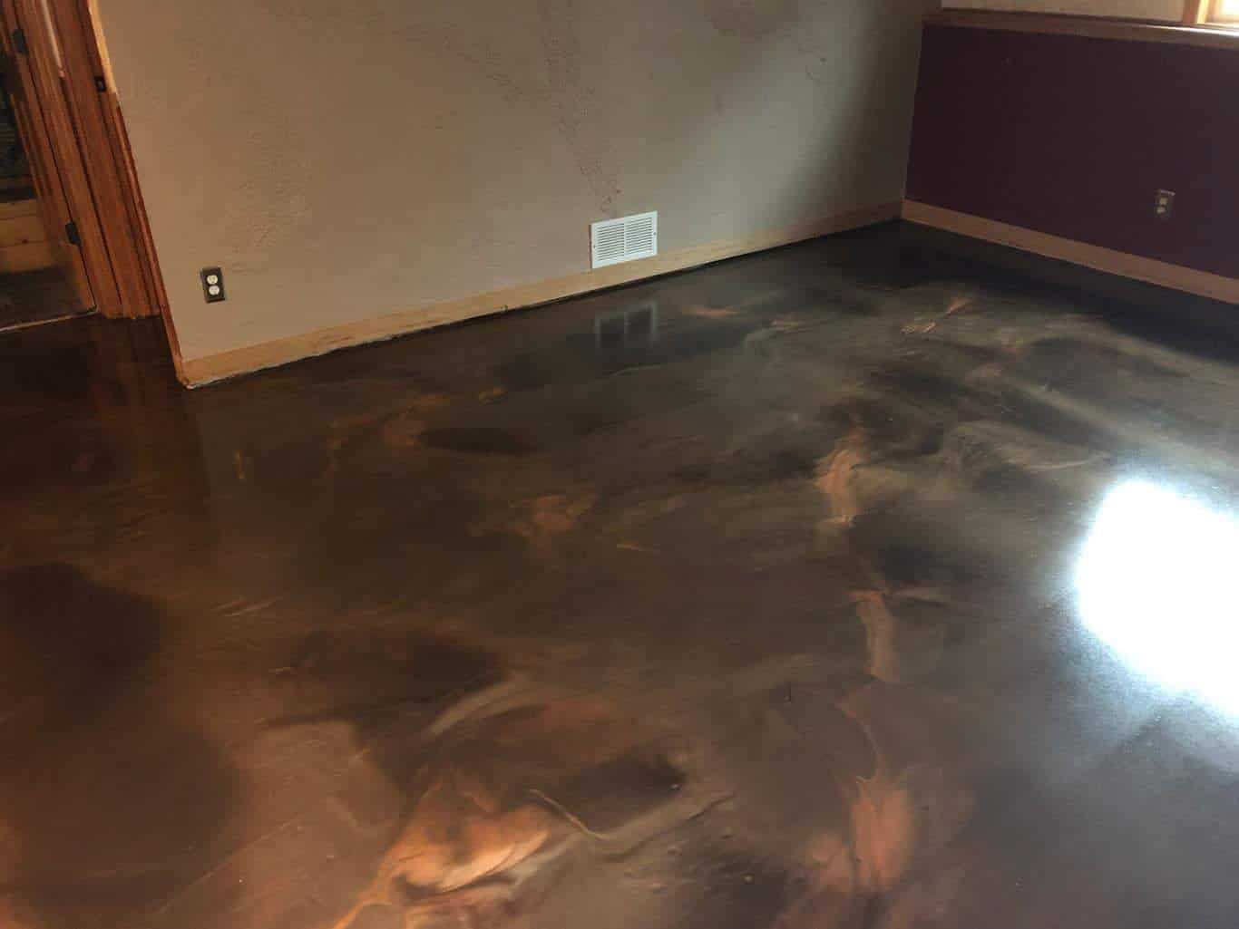 Polished stained concrete floor in Minnesota home, showcasing elegant marbled design and glossy finish, ideal for durable and stylish residential flooring solutions.