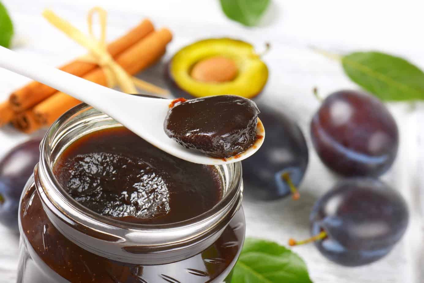 Spoon and jar with Polish plum butter called Powidlo.