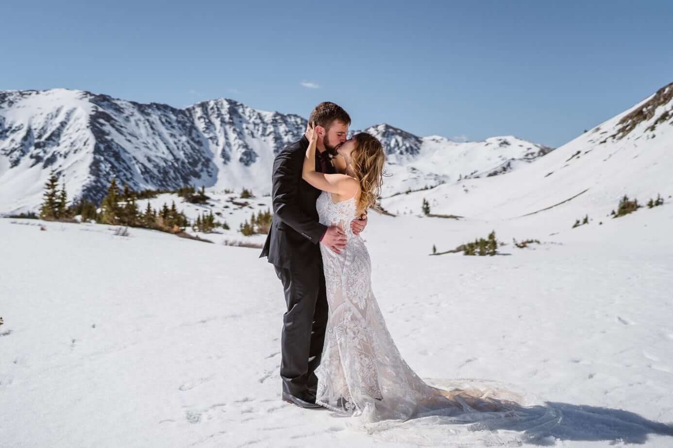 Bride and Groom Kissing Winter Elopement Guide