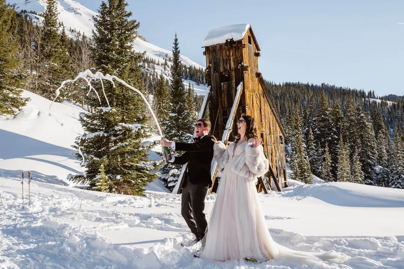 A couple spraying champagne in Telluride, Colorado.