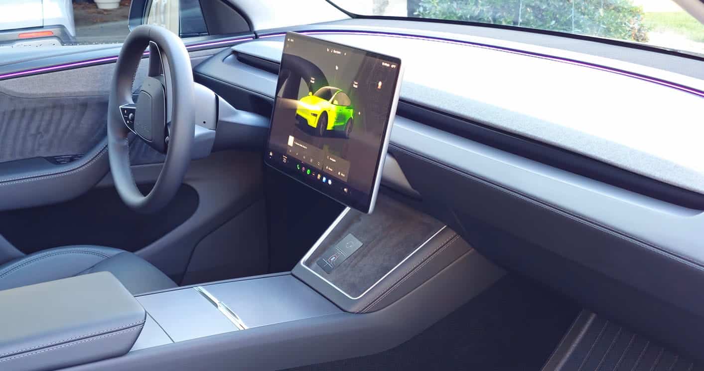 Car interior dashboard and touchscreen display after professional interior detailing in Charlotte NC