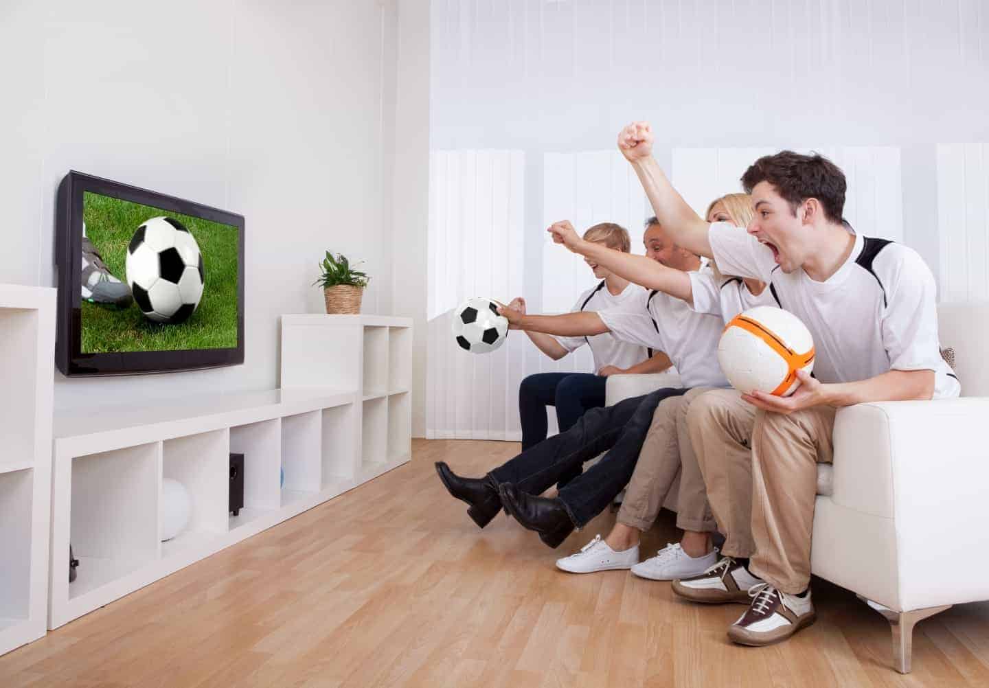 group watching football at home