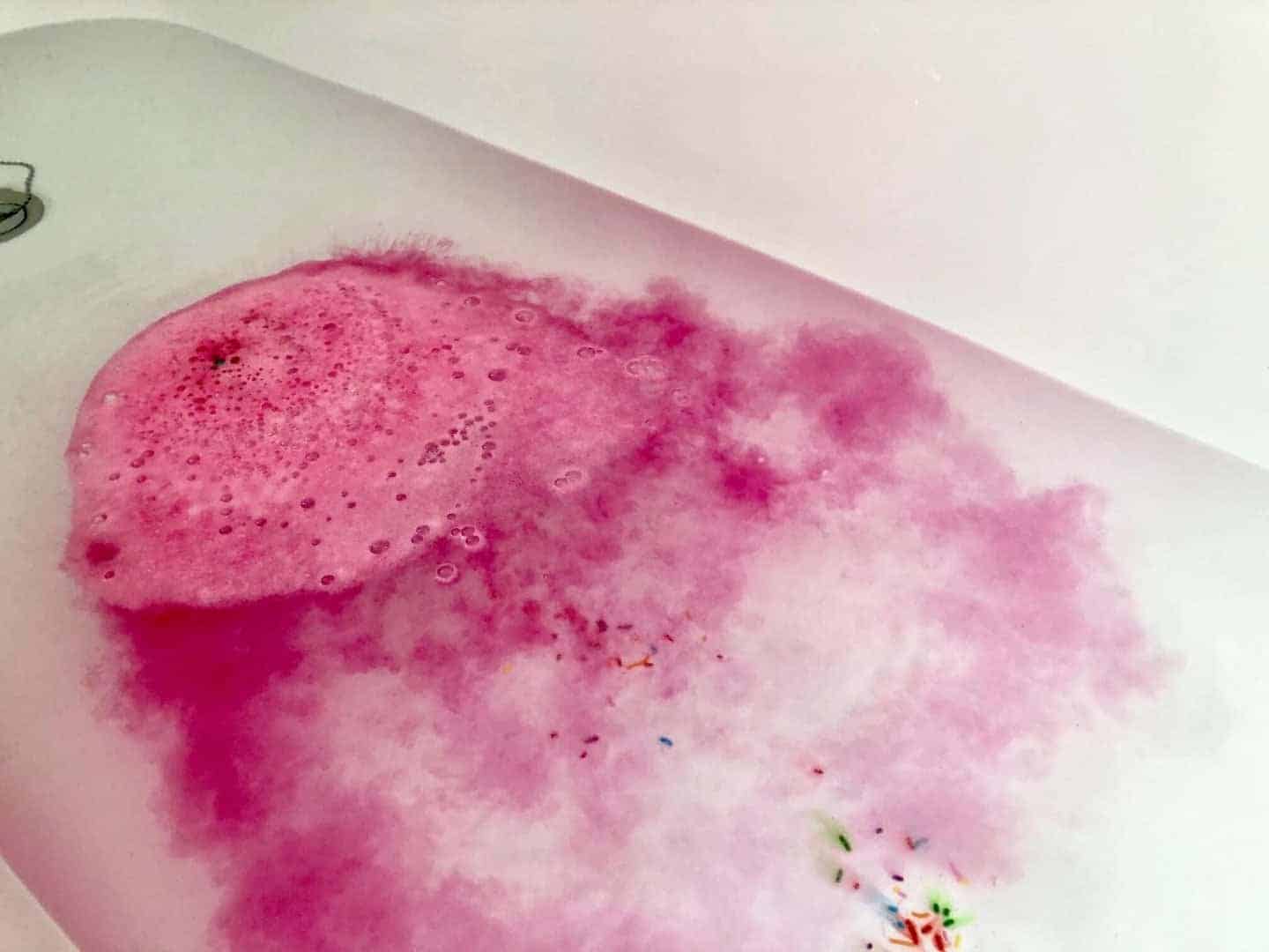 Fizzing bath bomb in the bath tub from So Bomb DIY