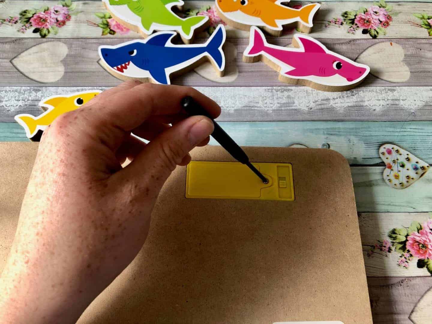 Baby-Shark-Wooden-Sound-Puzzle-putting-in-the-batteries