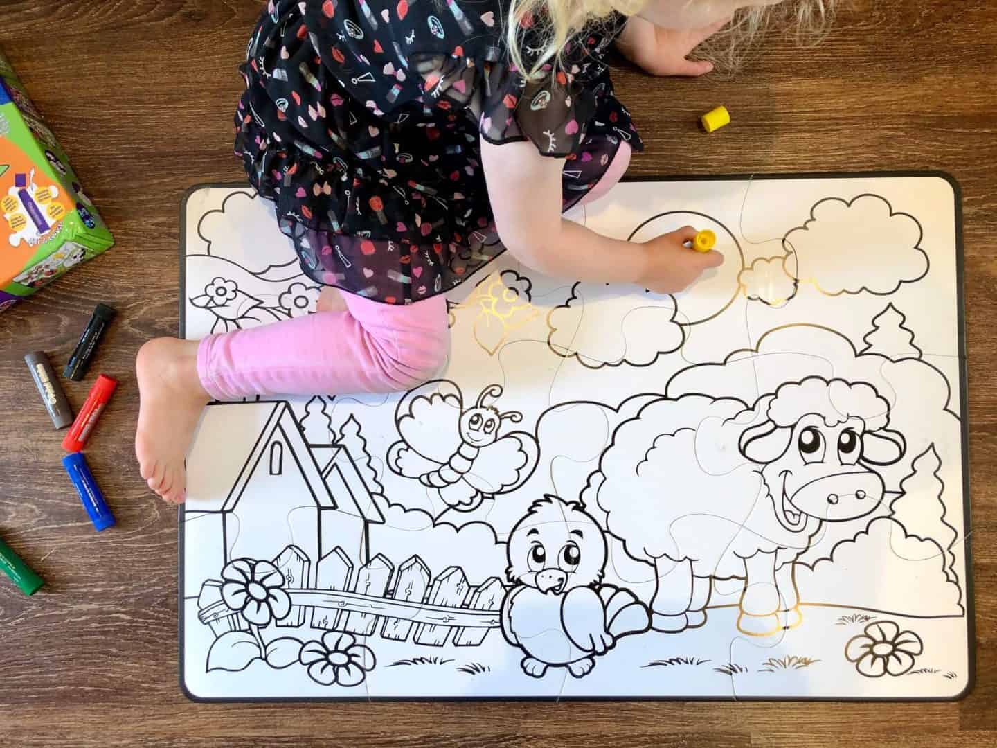 L painting the farm puzzle with her paint sticks