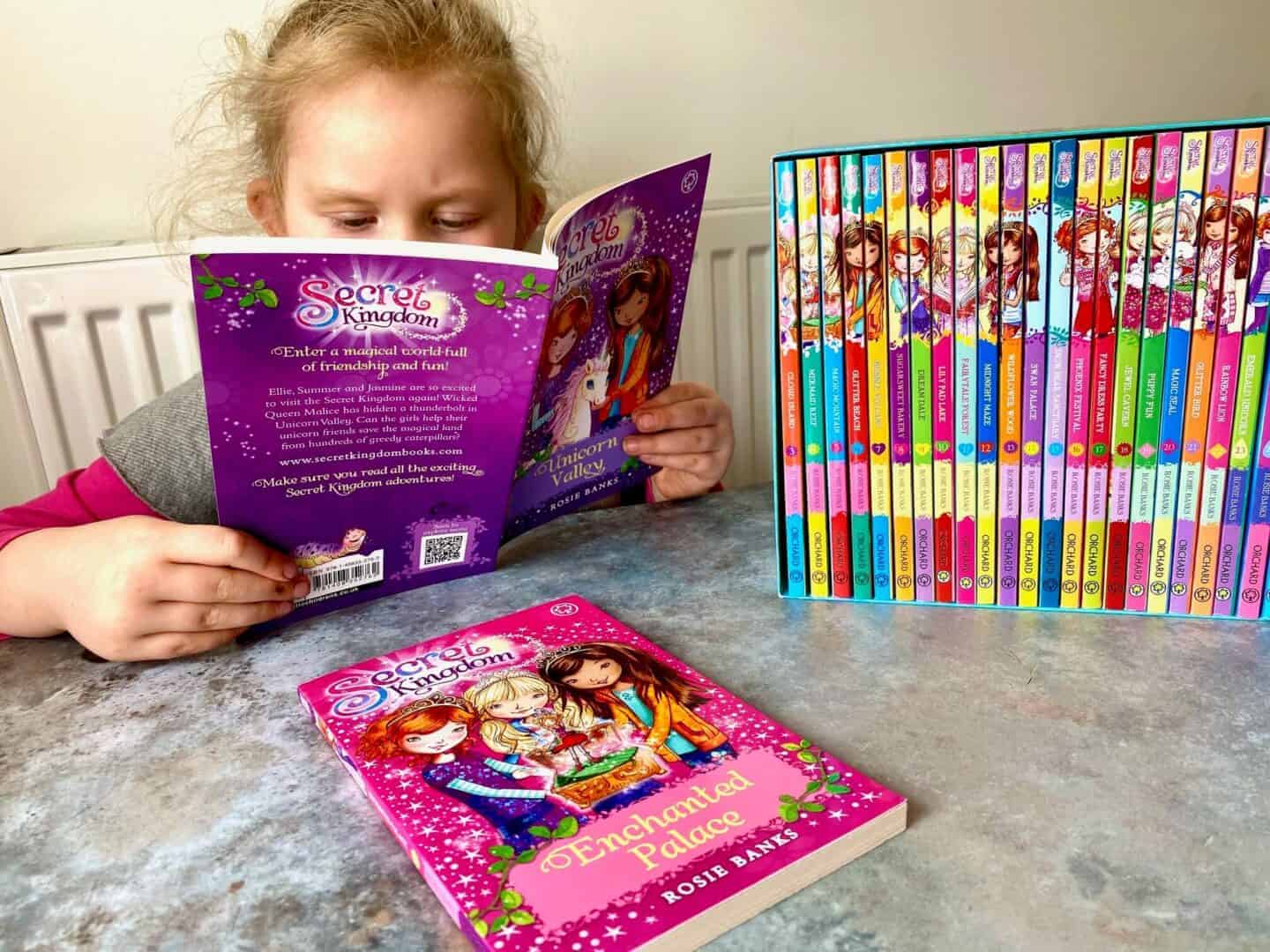 L reading The Secret Kingdom books as a confident reader