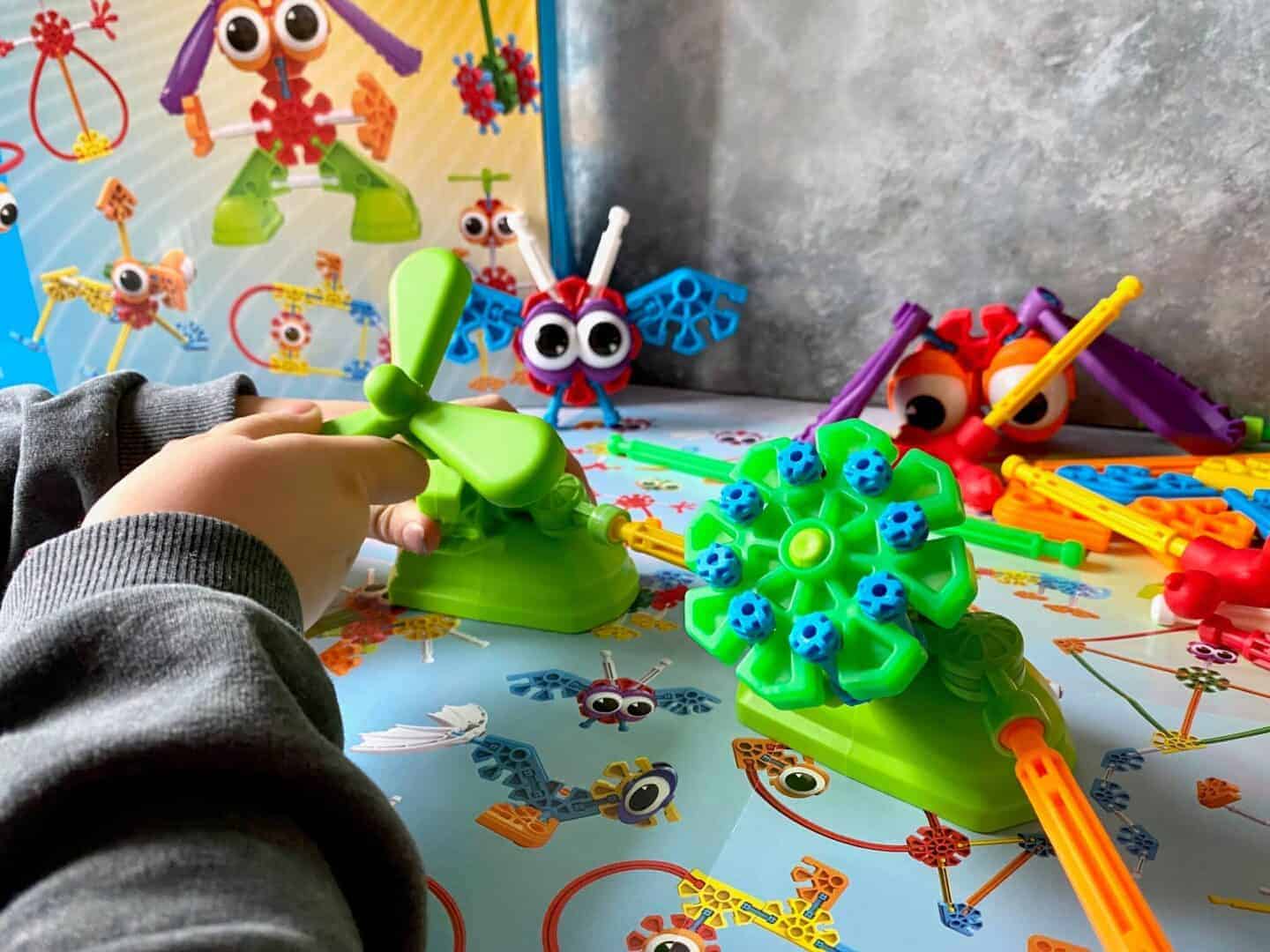 Kid KNex building an airplane cockpit