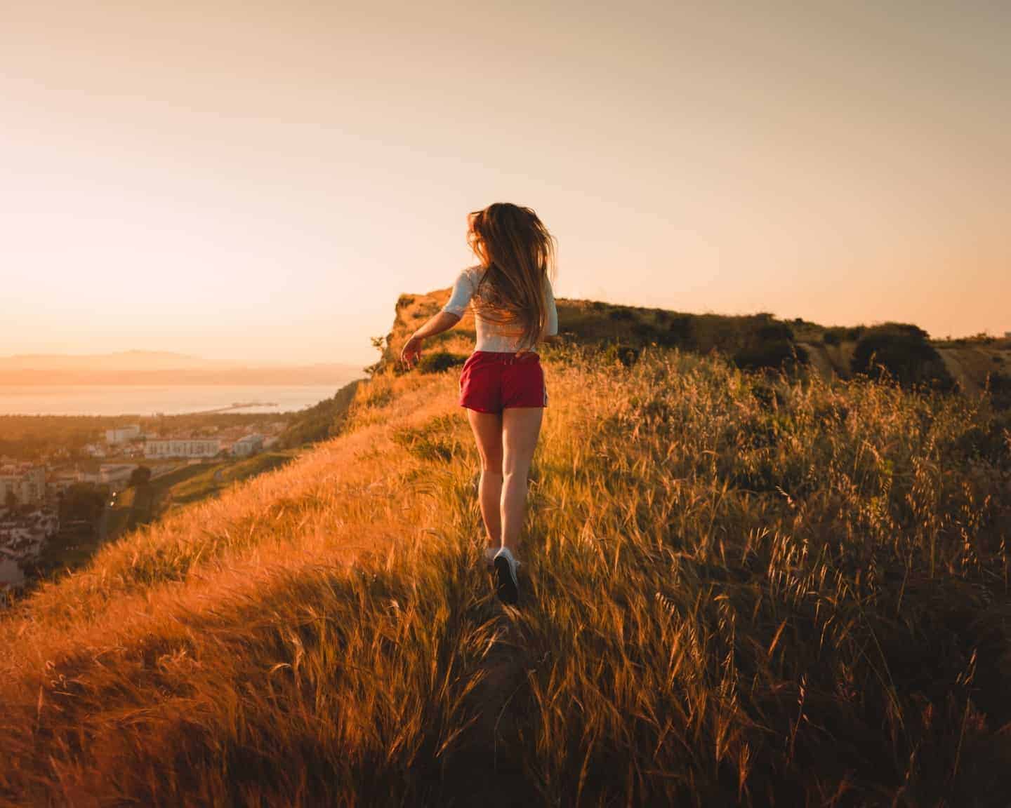 Woman running through a field