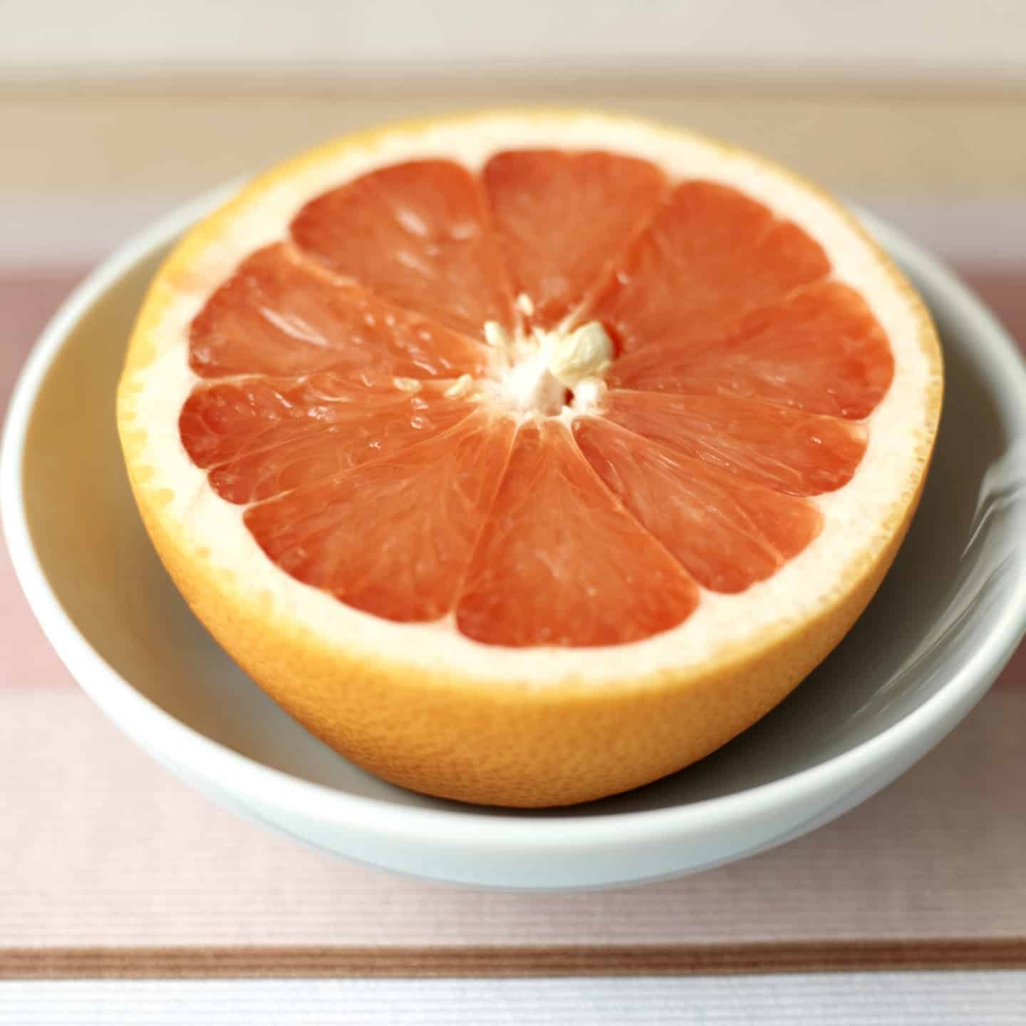 red grapefruit sliced in half.