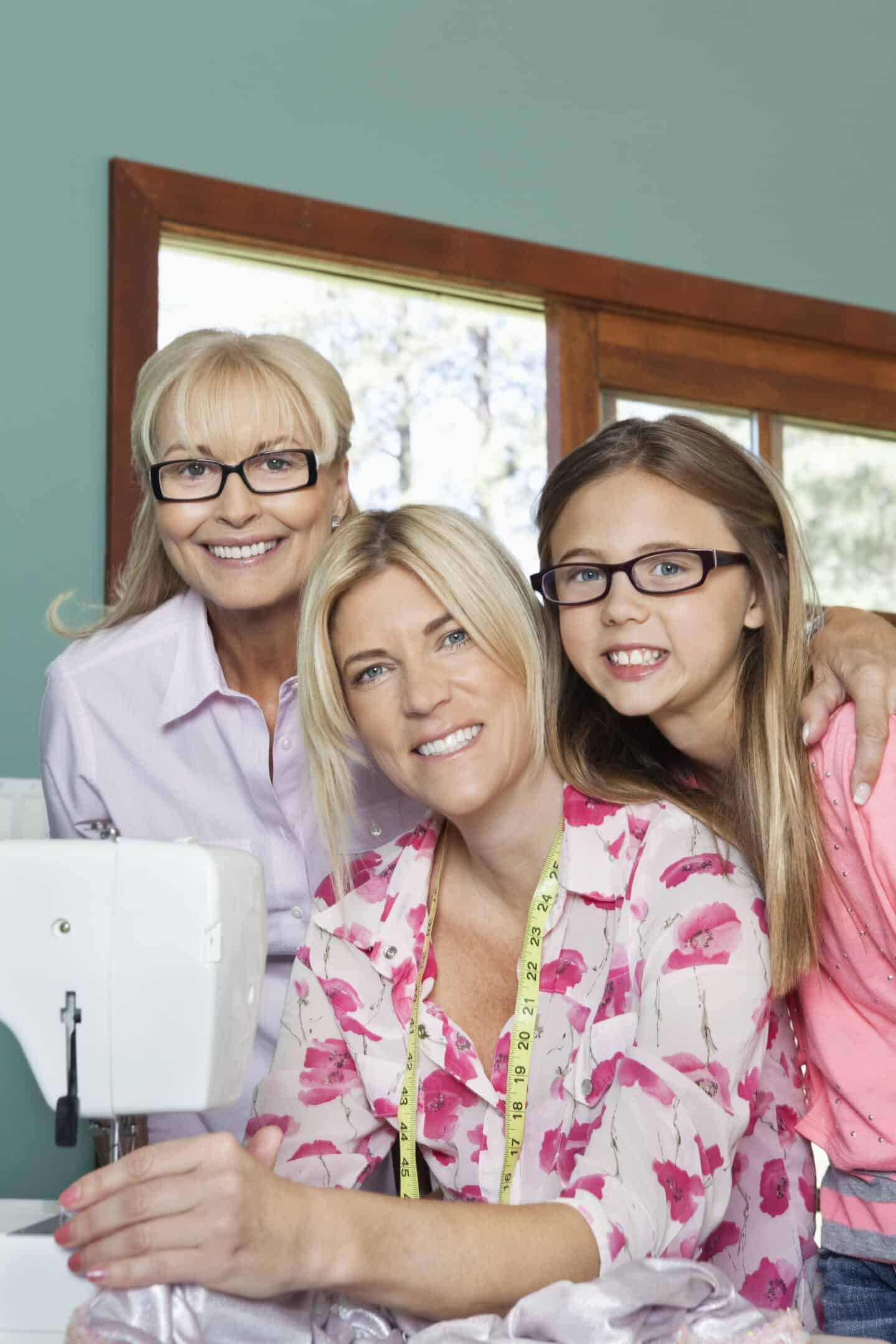 A blonde woman with spectacles, a blonde woman in pink top and young girl with spectacles
