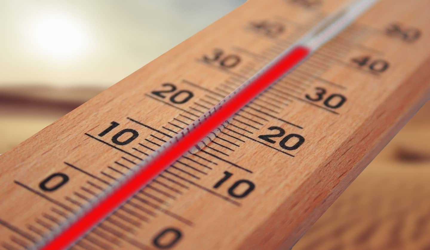 wooden thermometer showing temperature of the family home this summer