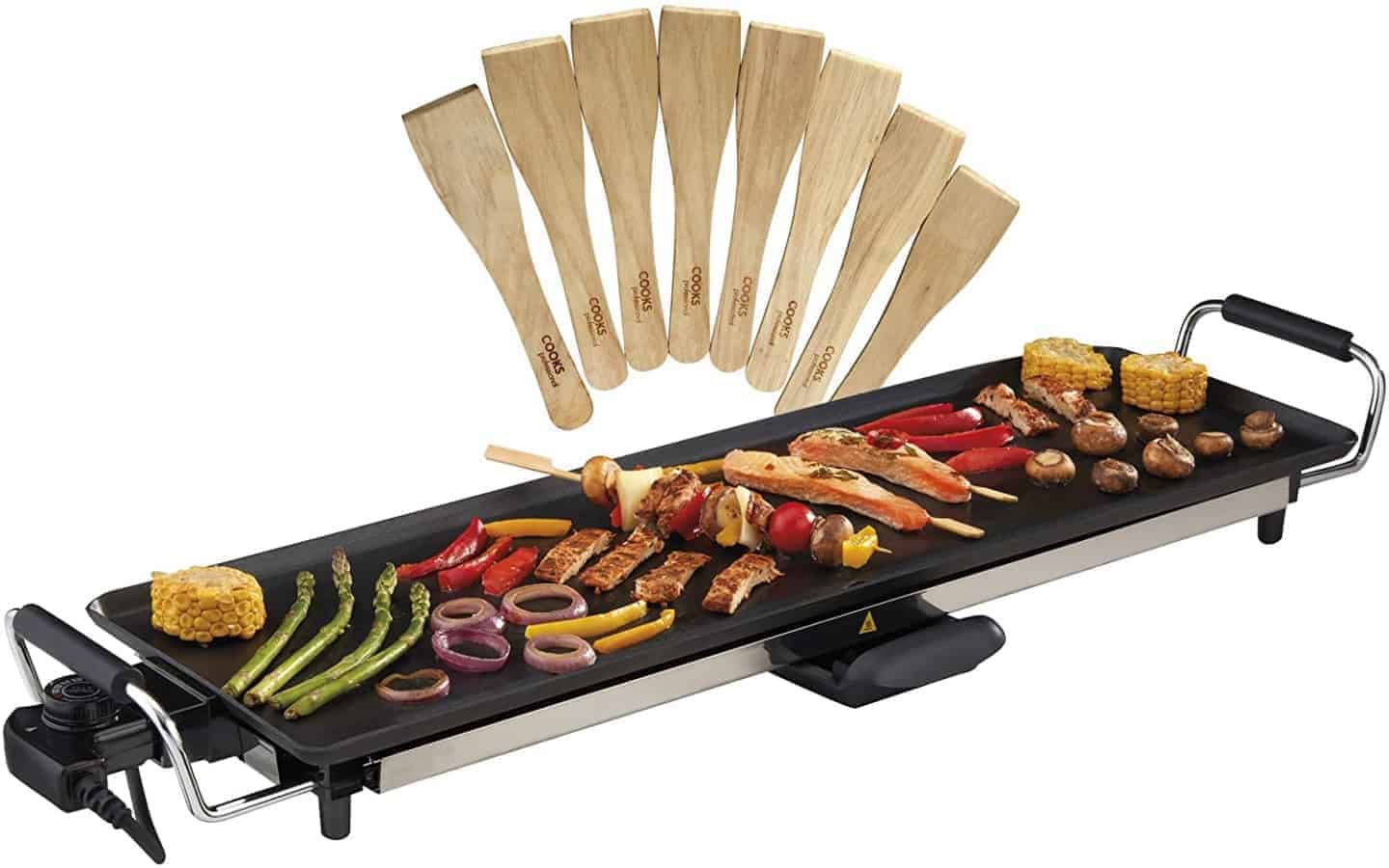 teppanyaki grill covered in food such as chicken and mixed vegetables.