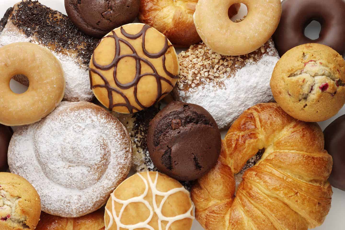 a selection of cakes and doughnuts